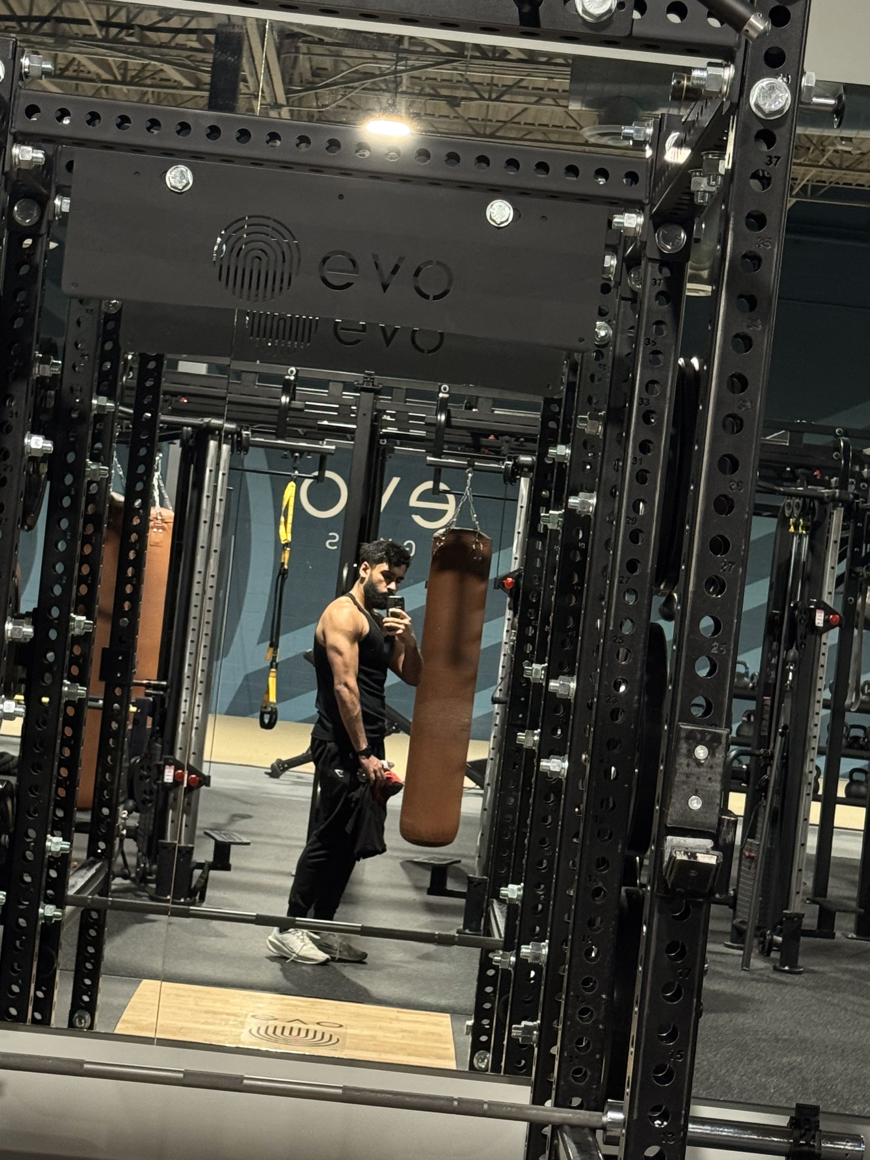 Coach Farhad in a gym mirror